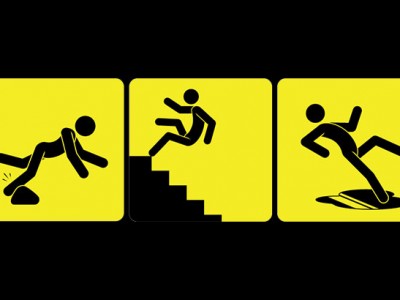 Three yellow warning signs illustrate common falls on private property: A stick figure tripping over a rock, another falling down stairs, and a third slipping on a wet surface. Each features bold black icons on bright yellow backgrounds. Three yellow warning signs illustrate common falls on private property: A stick figure tripping over a rock, another falling down stairs, and a third slipping on a wet surface. Each features bold black icons on bright yellow backgrounds.