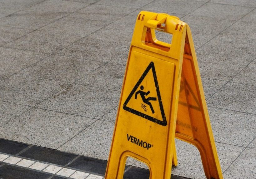 sip-n-fall-compensation-sydney-and-nsw to show caution due to wet surface - slip and fall