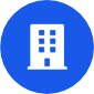 White icon of a multi-story building with windows and a door on a solid blue circular background. White icon of a multi-story building with windows and a door on a solid blue circular background.