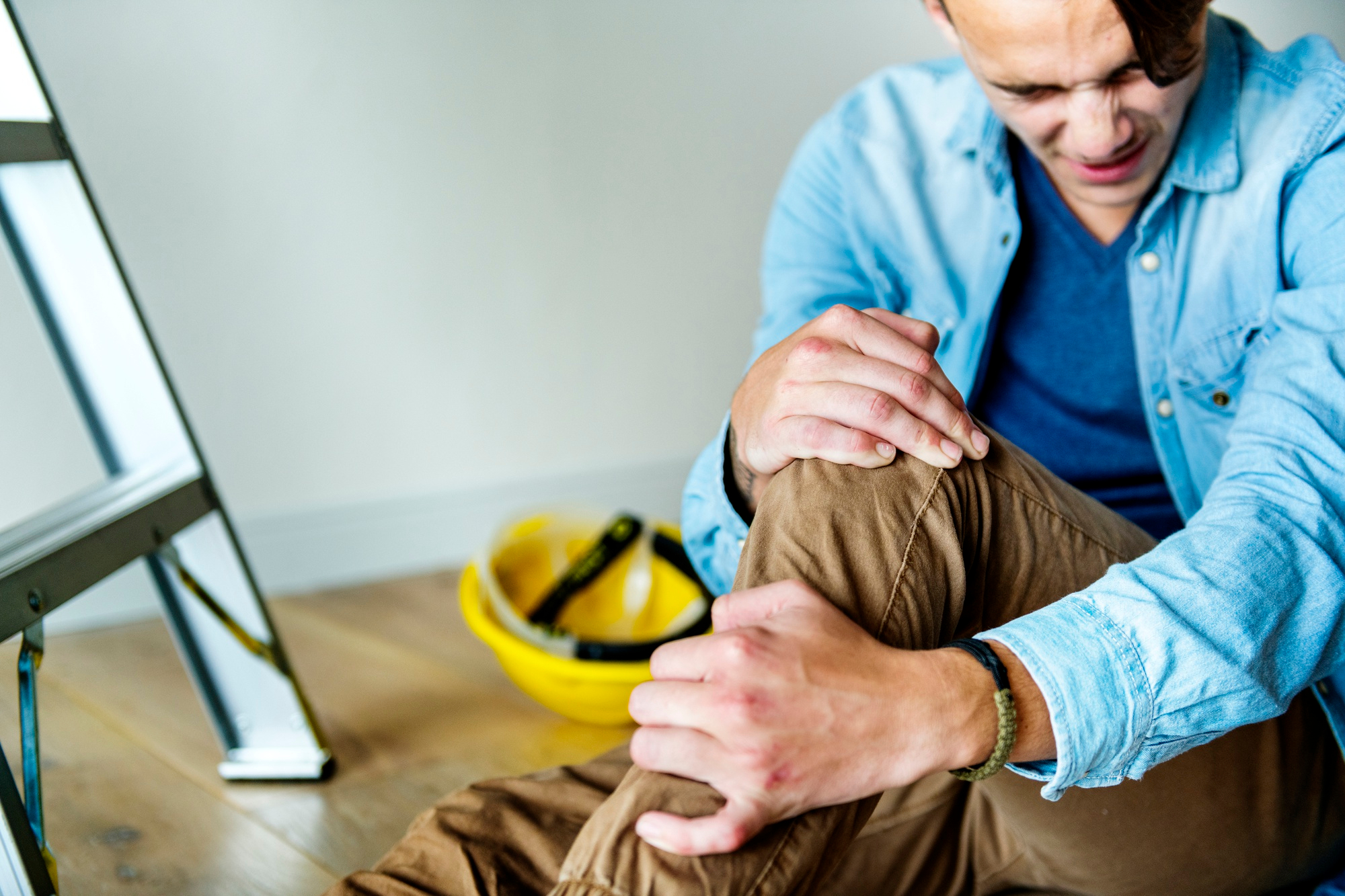 worker suffering from strained leg worker suffering from strained leg