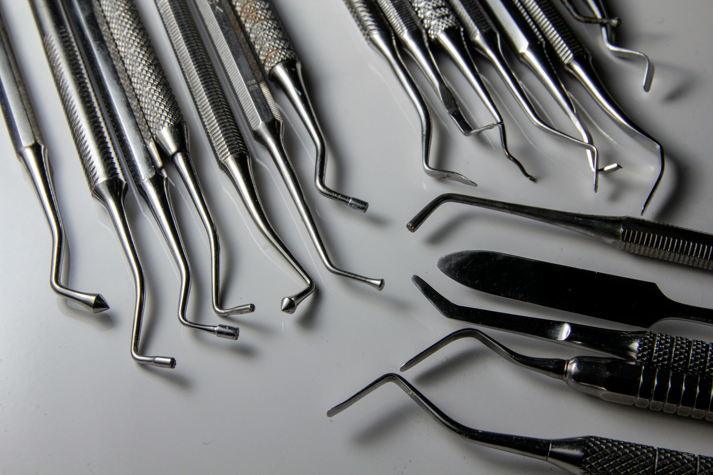 a bunch of surgical tools laying on a table a bunch of surgical tools laying on a table